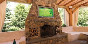 outdoor-living-room-flatscreen-tv-mounted-in-stone-fireplace-greenwich-ct-668x332_1